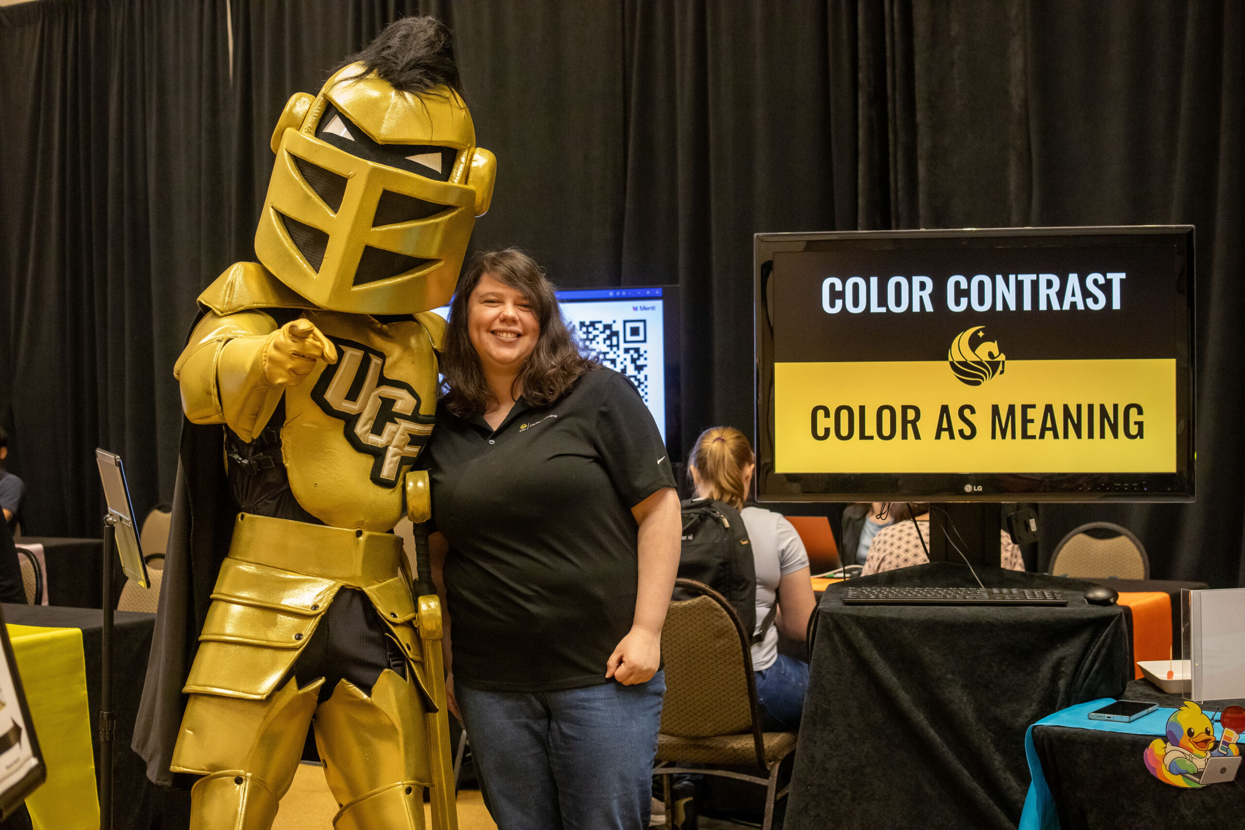 Knightro posing with the Color Contrast and Meaning station facilitator
