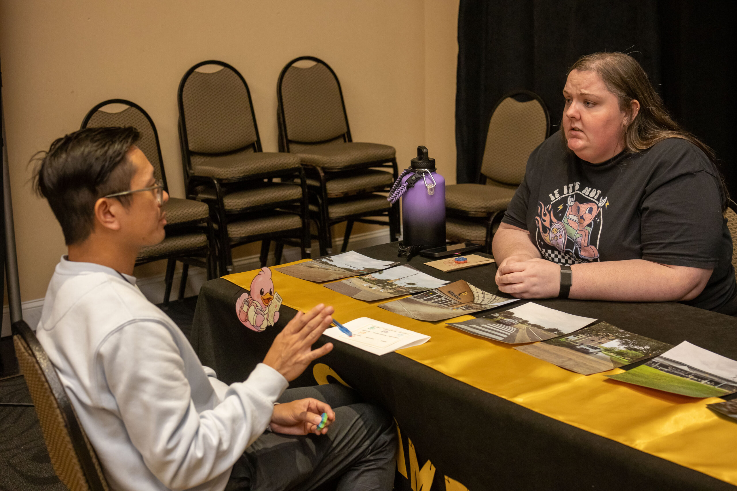 An attendee conversing with the Campus Access station facilitator