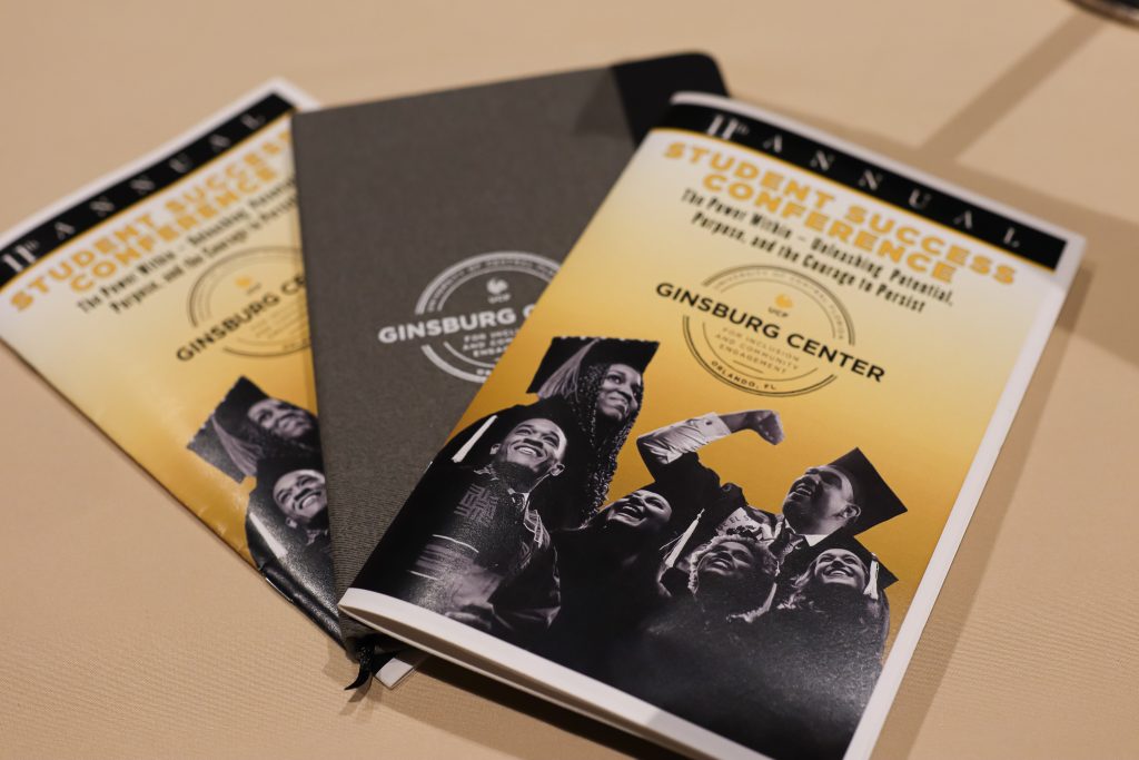 Program booklets for the 11th annual Student Success Conference and a notebook