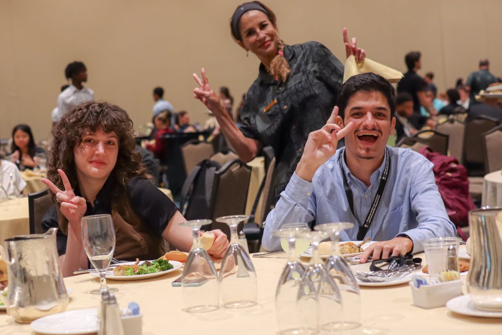 Students posing during dinner