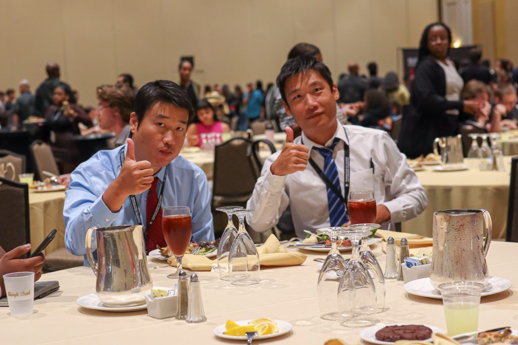 Students posing during dinner
