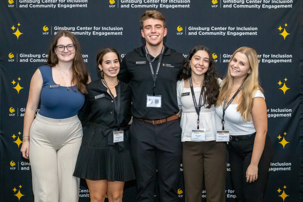 Student Government posing in front of a backdrop