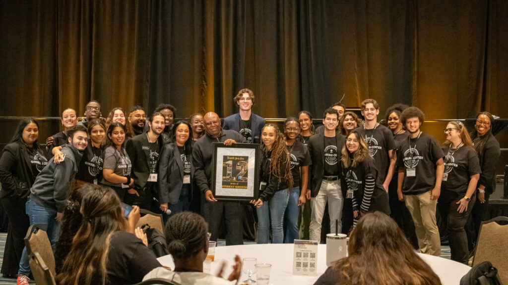 Peer mentors and staff honoring Mr. J for 12 years of conferences