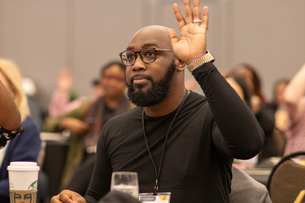 a faculty member raising their hand