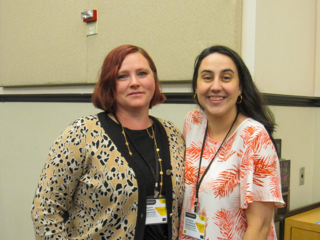 two staff members posing for a photo