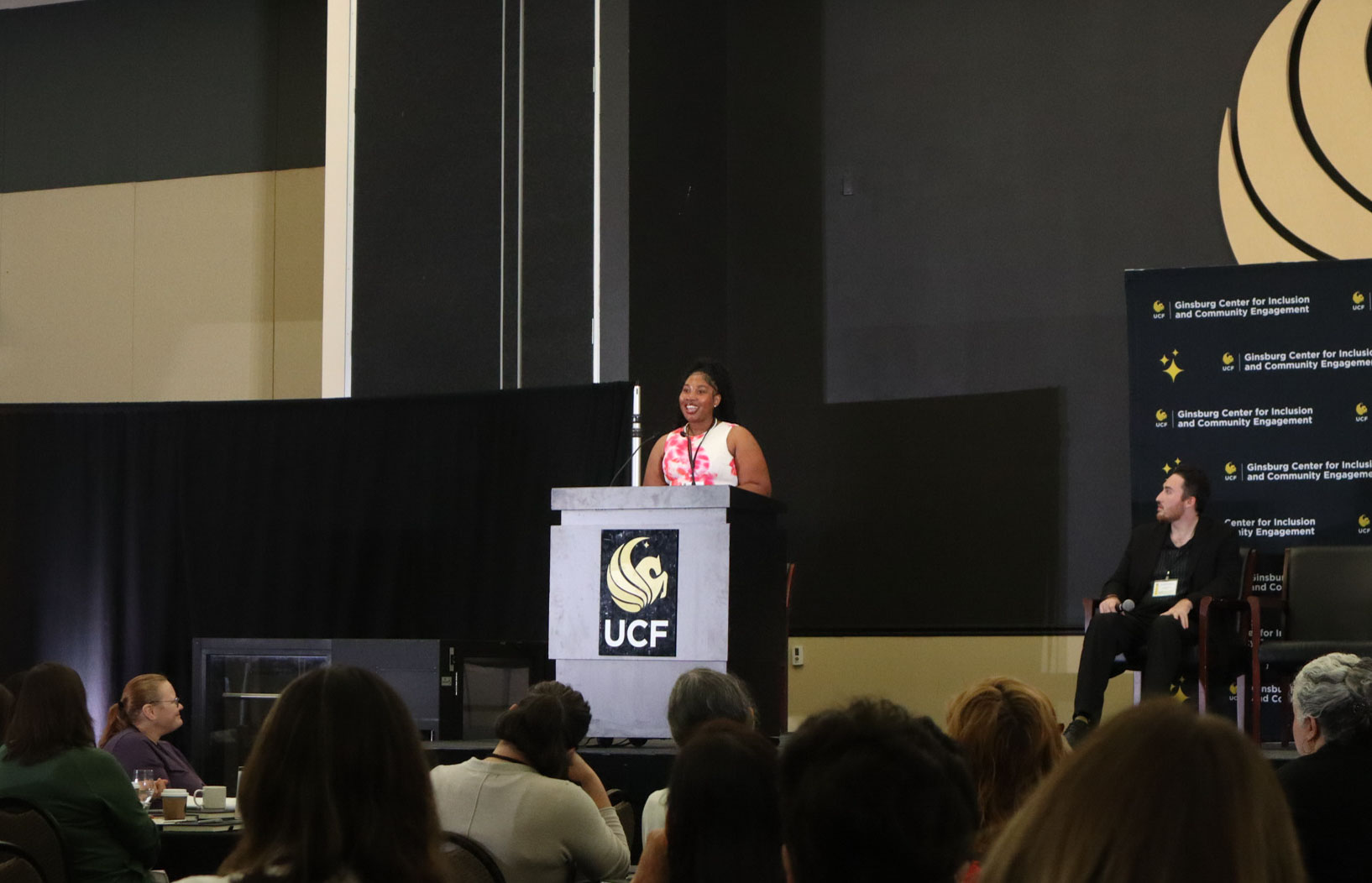 a featured knight speaking at the podium