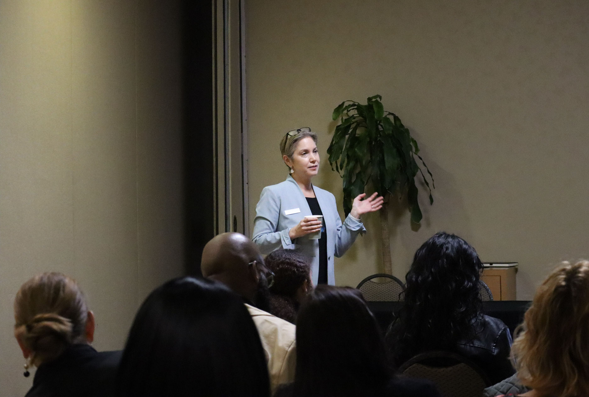a presenter speaking over a mic