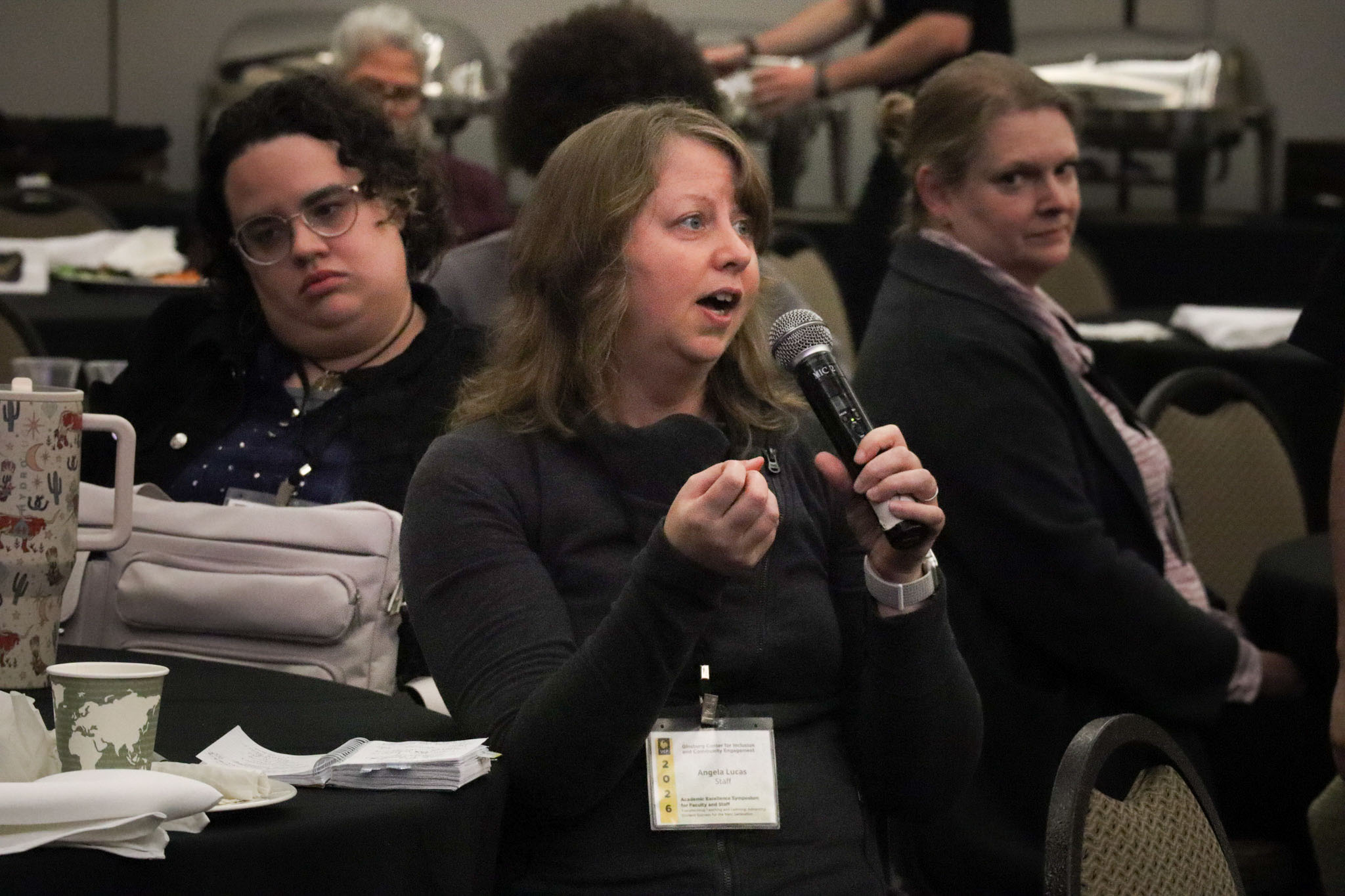 a ucf employee asking a question during the featured session