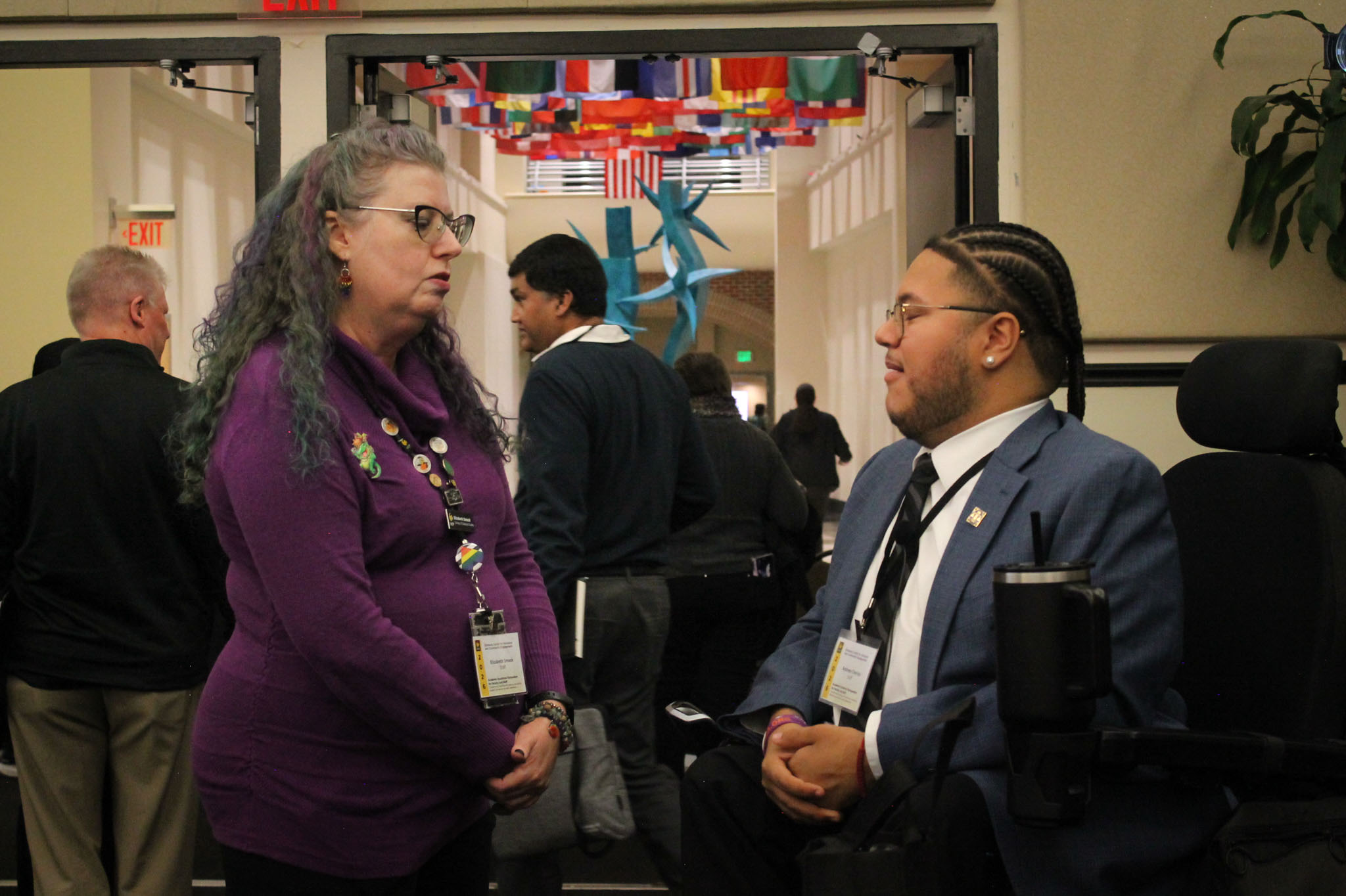 one of the featured knights speaking with a ucf employee