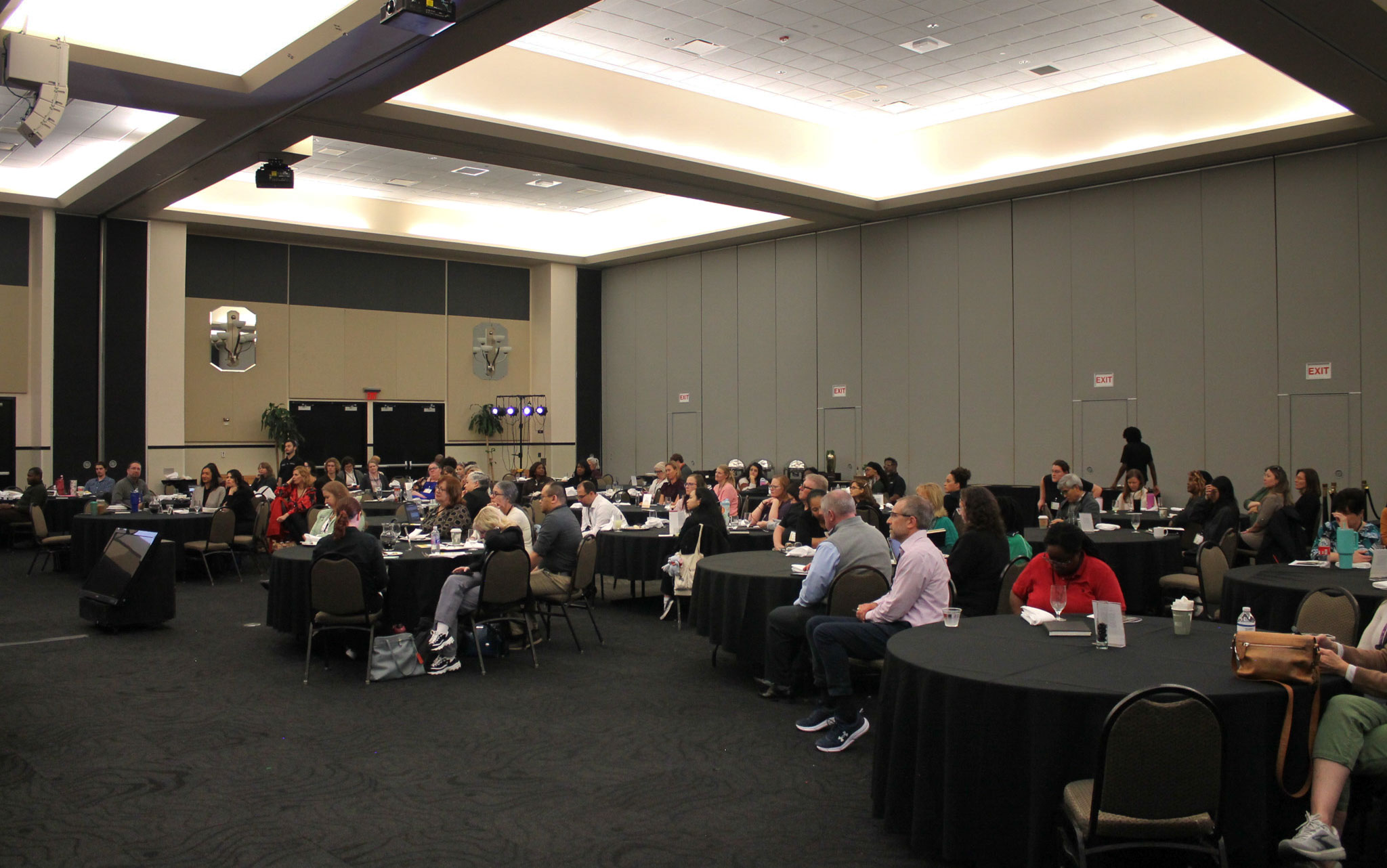 a wide shot of the pegasus ball room filled with attendees