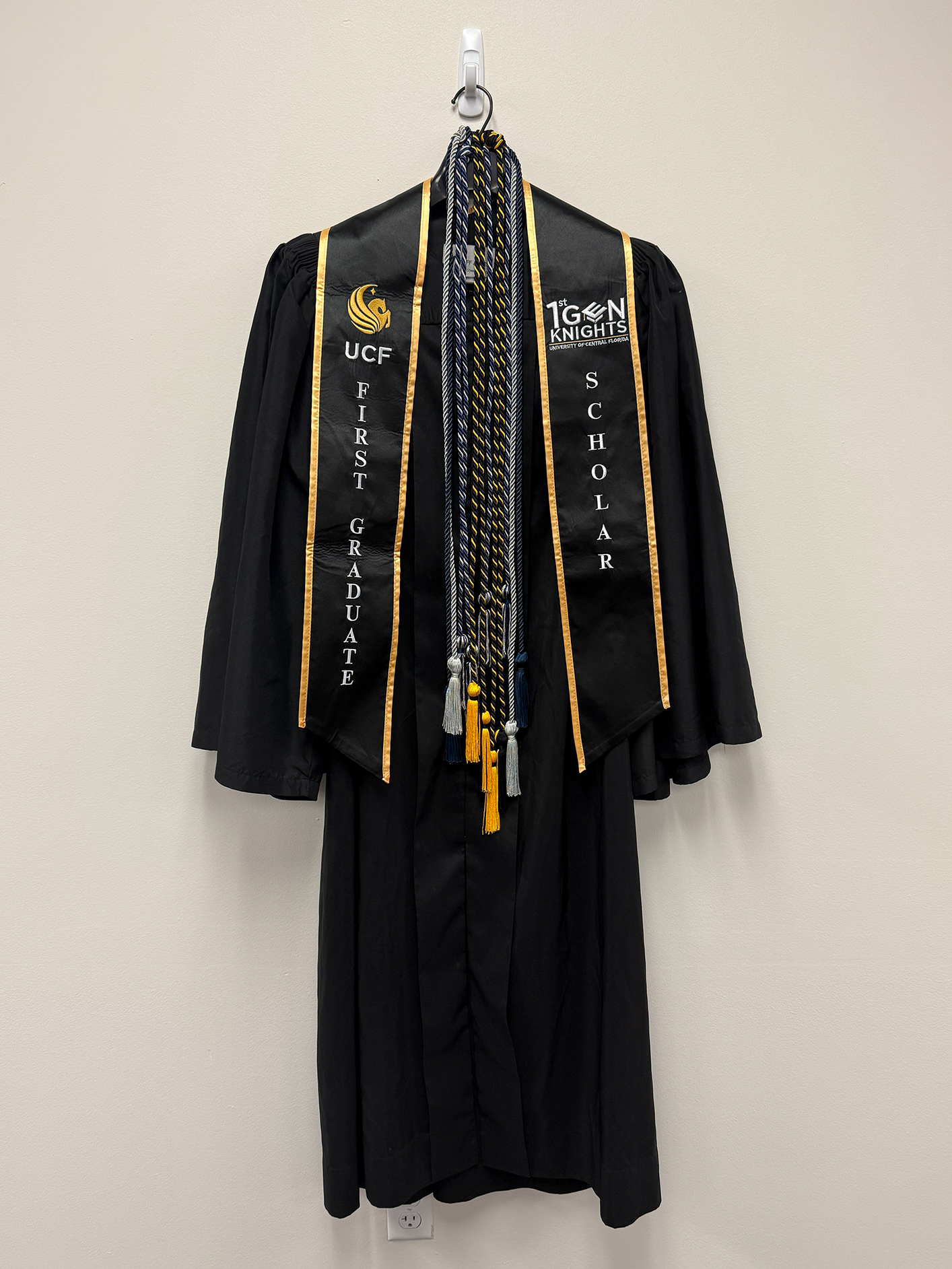 First generation regalia including a stole that reads first-generation and a cord