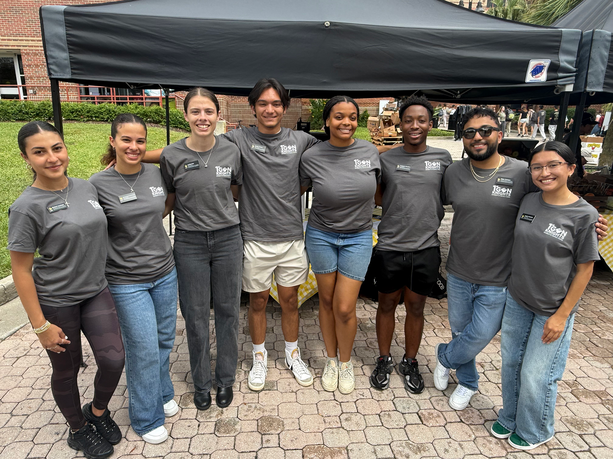 First Generation Coordinator with their student employees posing for a photo